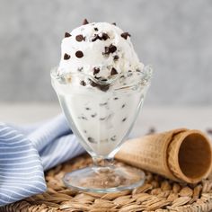 an ice cream sundae with chocolate chip cookies and whipped cream in a glass dish