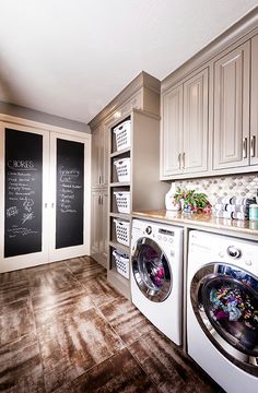 an instagram photo of a washer and dryer in a laundry room with chalkboard on the wall