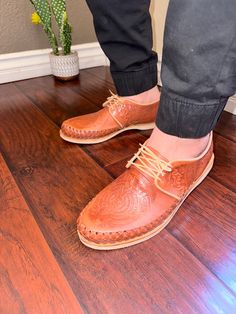 These genuine leather huaraches are handmade by artisans in Central Mexico. As a result, minor blemishes that do not take away from the appeal of the huaraches but instead speak to its handicraft, may be visible. They are woven using fine strips of genuine leather. This style of huarache sandal compliments casual looks paired with denim, chinos, and shorts. Another great combination is to wear the huaraches with a light blazer and linen or cotton blend dress pants. Sizing If you normally wear a Artisan Leather Huaraches With Woven Sole, Artisan Huarache Sandals With Rubber Sole, Traditional Woven Leather Huaraches, Traditional Leather Woven Huaraches, Artisan Slip-on Huaraches With Woven Sole, Artisan Leather Huaraches With Rubber Sole, Artisan Huarache Sandals With Stitched Sole, Artisan Huaraches With Woven Sole, Traditional Hand Tooled Brown Huarache Sandals