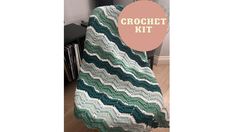 a crocheted blanket sitting on top of a chair