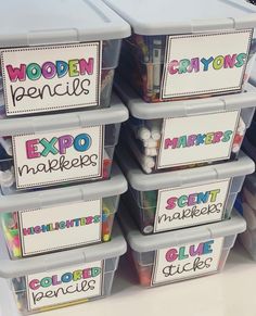 several plastic containers with labels on them are stacked up in front of each other and labeled expo makers