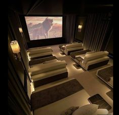 an image of a movie room with couches