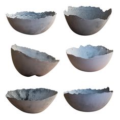 four bowls with different shapes and sizes are shown in the same image, one is empty