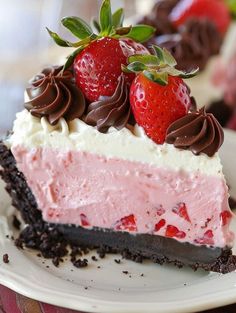 a piece of cake with strawberries and chocolate on top