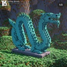 an image of a blue dragon made out of legos in the middle of a field