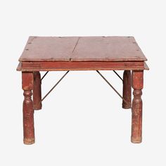 an old wooden table with two legs and a small top on it's side