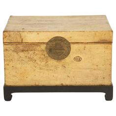 an old wooden box with a metal handle on the front and bottom, sitting against a white background