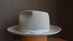 Handcrafted fedora inspired by the hat worn by Jeff Bridges in Seabiscuit Originally custom made by Baron Hats Custom made to order, please allow 8-12 weeks for delivery. Store credit or exchange only. Crown Front: 5-1/4" Crown Back: 4-3/4" Brim: 3" Color: Silverbelly Hatband: 1" matching silver grosgrain ribbon and binding * Disclaimer: "Seabiscuit", is TM and © (or copyright) by DreamWorks Pictures, Spyglass Entertainment, The Kennedy/Marshall Company, and Larger Than Life Productions. Any rep Pork Pies, Mens Dress Hats, Custom Cowboy Boots, Los Angeles Street, Jeff Bridges, Diva Style, Pork Pie, Larger Than Life, Straw Fedora