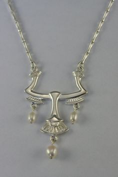 This necklace represent a unique and beautiful motif of lotus flower inspired from egypt and inspired from art nouveau style as well. It is very original, drawn and made by the artist. A perfect blend of past and present,  it is a one-of-a-kind jewel which will pass the test of time. A ideal present  for birthday(anniversary), Mother's Days, wedding, Christmas or to offer itself to oneself! Lotus Flower Jewelry, Art Nouveau Necklaces, Egyptian Necklace, Jewelry Elegant, Elegant Necklace, Flower Jewelry, Hand Made Jewelry, Black Pearl, Jewelry Handmade