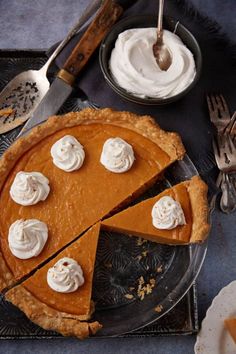 there is a pie on the table with whipped cream