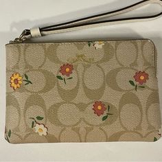 Nwt Coach Light Khaki/ Multi Corner Zip Wristlet With Nostalgic Ditsy Print Signature Coated Canvas And Smooth Leather Two Credit Card Slots Zip-Top Closure Fabric Lining Wrist Strap Attached 6.25”L X 4”H X .5”W A45 Spring Wristlet With Wrist Strap For Everyday Use, White Wristlet For Daily Use In Spring, Rectangular Wristlet For Daily Use In Spring, Wristlet For Everyday Use In Spring, Casual Wristlet With Wrist Strap, Spring Travel Wristlet With Zipper Closure, Beige Rectangular Wristlet For Spring, Rectangular Beige Wristlet For Spring, Beige Wallets For Spring