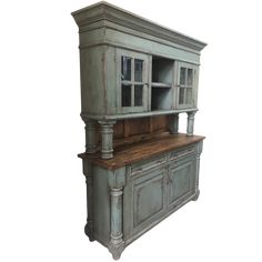 an old style hutch with wooden top and drawers on the front, against a white background