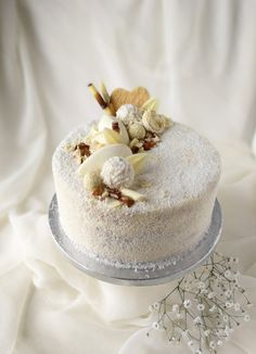 a cake with white frosting and various toppings