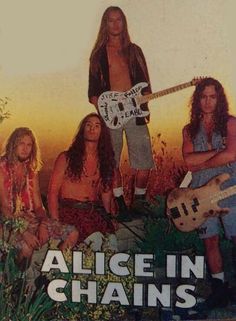 the group of men are posing with their guitars