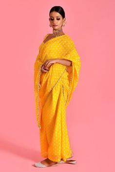 Yellow palazzo with bandhani pattern and pearl tassel embellished border on attached pallu. Paired with embellished padded blouse. - Aza Fashions Georgette Pre-draped Saree With Gota Work, Pre-draped Georgette Saree With Gota Work, Bollywood Style Traditional Drape Palazzo Set For Navratri, Navratri Bollywood Style Traditional Palazzo Set, Bollywood Style Palazzo Set For Navratri, Pre-draped Saree With Gota Work For Navratri Reception, Pre-draped Saree For Puja Festivals, Georgette Palazzo Set With Pallu In Traditional Drape, Traditional Draped Palazzo Set With Pallu In Georgette