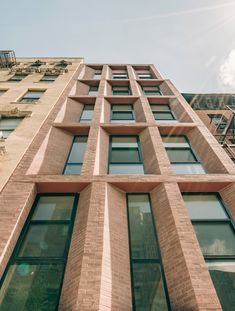 a tall brick building with lots of windows