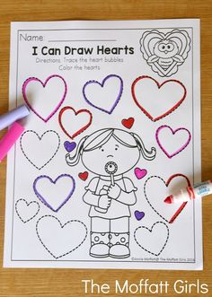 valentine's day coloring pages with markers and crayon pencils on the table