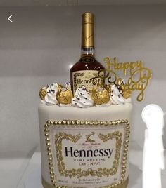 a bottle of hennessy with gold trimmings on the top and bottom