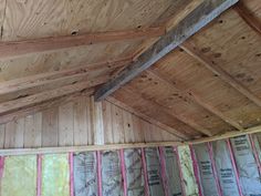 the inside of a house being built with wood and insulation