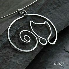 a silver necklace with a cat on it