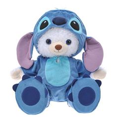 a blue and purple stuffed animal with ears