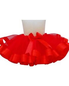 This is a red tutu skirt with a red satin ribbon.  Beautiful for birthdays or any celebrations.  Handmade and can be made to order at any size or age. Toddler girl outfit.  Birthday party outfit. Red Toddler Tutu Skirt. Baby girl tutu. Birthday tutu dress. Baby Christmas dress. Toddler tutu dress. Girl tutu dress. Girl tutu skirt  Black Tutu Skirt.  Birthday girl outfit.  Baby girl tutu.  Toddler girl tutu.  Girls skirt. Birthday gifts. 1st birthday outfit.  My tutus are all made by sewing and ironing.  It has a perfect finish. My tutus are all made by sewing and ironing.  It has a perfect finish. Rainbow Tutu Skirt. Baby girl tutu dress. Toddler girl tutu skirt. Toddler dress.  sunflower dress baby girl tutu skirt. Girl tutu dress. Tutu skirt for toddlers, babies, and girls.  Can be custo Elegant Christmas Tutu Dress For Holiday, Red Ruffled Tutu Dress For Summer, Elegant Christmas Holiday Tutu Dress, Summer Red Tutu Dress For Dress-up, Red Summer Tutu Dress Costume, Fitted Red Tutu Dress For Summer, Princess Style Christmas Tulle Tutu Dress, Red Ruffled Petticoat For Summer, Red Ruffled Summer Petticoat