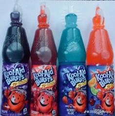 three bottles of kool - aid burst are lined up