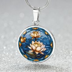 Water Lily Birth Flower Necklace, a stunning piece from our Birthflower collection, features an Engraved Birth Month Flower design, making it an ideal choice for Mothers Day Gifts & Valentines Gifts For Her. ➜ Our Birth Flower Jewelry is made of high quality surgical steel with a graphic image that's printed directly onto the steel surface with a shatterproof liquid glass coating and includes an 18k gold finish option. ➜ Our Engraved Birth Flower Pendant Necklaces are personalized in the U.S.A b Vintage Round Jewelry Gift For Mom, Nature-inspired Round Necklace For Gift, Vintage Birth Flower Necklaces For Jewelry Making, Mother's Day Birth Flower Jewelry For Jewelry Making, Vintage Round Jewelry With Birth Flower Design, Pressed Flower Jewelry For Mom, Nature-inspired Round Necklace As A Gift For Her, Pressed Flower Jewelry As A Gift For Mom, Nature-inspired Round Necklace For Her