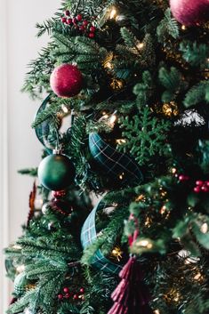 a christmas tree with ornaments and lights on it