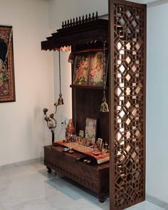 a wooden shelf with pictures on it in a room