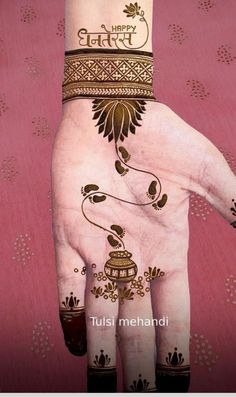 a woman's hand with henna on it