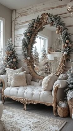 a living room decorated for christmas with white furniture and wreaths on the wall,