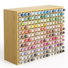 a multicolored wooden pegboard with multiple rows of small objects on it's sides