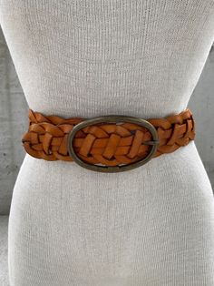 Vintage 1990s Elise M belt, braided brown leather belt, woven tan genuine leather belt, southwestern style, rodeo houston outfit, cowgirl Transport yourself to the rugged and free-spirited vibe of the 1990s with this Vintage Elise M Braided Light Brown Leather Belt, a true gem that captures the essence of southwestern style. Crafted from genuine tan leather, this woven belt features intricate braided details that exude an air of craftsmanship and authenticity. The light brown hue adds warmth and earthiness to your ensemble, making it a perfect choice for both casual and boho-inspired looks. With its unique design and textured appeal, the Vintage Braided Leather Belt is reminiscent of the cowgirl culture that flourished during the rodeo days in Houston and beyond. This belt is the perfect a Vintage Brown Belt For Rodeo, Vintage Brown Belts For Rodeo, Bohemian Brown Belts For Summer, Bohemian Brown Rope Belt, Adjustable Rustic Brown Belt, Rustic Adjustable Brown Belt, Rustic Brown Adjustable Belt, Bohemian Brown Belt For Ranch, Rodeo Houston