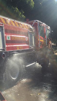 a fire truck spraying water on the street