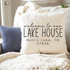 a pillow that says welcome to our lake house