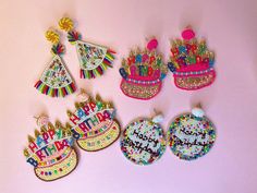 "HAPPY BIRTHDAY SEED BEAD EARRINGS  **STYLE #1 - Shape: Birthday Cake / Drop - Size: 3\" (L) x 2 1/2\" (W) - Closure: Lead compliant push back post - Color: Multi - Material: Lead compliant plated metal, Bead, Polyester **STYLE #2 - Shape: Birthday Cake / Drop - Size: 3\" (L) x 2 1/2\" (W) - Closure: Lead compliant push back post - Color: Multi - Material: Lead compliant plated metal, Bead, Polyester **STYLE #3 - Shape: Birthday Disc / Drop - Size: 2 3/4\" (L) x 2\" (W) - Closure: Lead compliant push back post - Color: Multi - Material: Lead compliant plated metal, Bead, Polyester **STYLE #4 - Shape: Birthday Hat / Drop - Size: 3 1/4\" (L) x 1 3/4\" (W) - Closure: Lead compliant push back post - Color: Multi - Material: Lead compliant plated metal, Bead, Polyester *Please note the product Novelty Beaded Earrings For Gift, Birthday Candle Earrings, Cheap Novelty Birthday Earrings, Beaded Cupcake Earrings, Playful Pink Birthday Earrings, Birthday Hat, Seed Bead Earrings, Fun Earrings, Birthday Theme