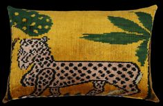 a decorative pillow with a cheetah on it