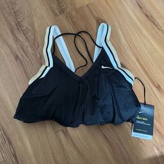 Light Support Size Small Black Sporty Sports Bra For Summer, Black Athleisure Activewear For Beach, Black Athleisure Activewear For The Beach, Black Breathable Athleisure Swimwear, Black Stretch Swimwear For Sports Events, Casual Nike Swimwear For Sports, Casual Nike Sports Swimwear, Black Sleeveless Sports Bra For Beach, Sporty Black Top For The Beach