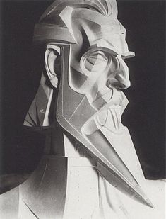 a black and white photo of a man's head with a knife in his mouth