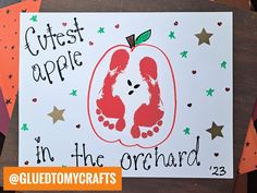 a handprinted card with an apple on it and the words cutest apple in the orchard