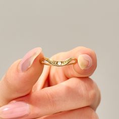 This 14k solid gold stacking ring boasts delicate moon phases engraved along the curve, adding celestial charm. Designed to complement small engagement rings, it's a perfect fit for those seeking simplicity and elegance. Choose from 14k, 18k, or 10k gold options in yellow, rose, or white, allowing you to customize your piece to perfection. Enhance your ring stack with this timeless lunar-inspired beauty. Features * Gold KT: 10K Solid Gold * Custom Gold Color: Yellow Gold, White Gold, Rose Gold * Anniversary Crescent Jewelry Engraved, Yellow Gold Crescent Rings For Promise, Dainty Crescent Wedding Rings, Delicate Stackable Rings In Recycled Gold For Anniversary, Delicate Recycled Gold Stackable Rings For Anniversary, Celestial Engraved Yellow Gold Anniversary Ring, Anniversary Celestial Engraved Ring In Yellow Gold, Crescent Shaped Yellow Gold Wedding Rings, Dainty Crescent Wedding Jewelry