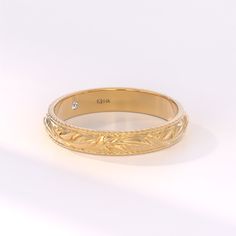 The Small Hidden Moissanite Feather Ring is a masterpiece of nature-inspired jewelry, handcrafted in lustrous 14k solid gold. This exquisite piece is more than just a ring; it's a work of art that beautifully captures the essence of a plant, symbolizing peace, harmony, and growth. Features * Gold KT: 10K, 14K, 18K * Custom Gold Color: Yellow Gold, White Gold, Rose Gold * Width of Band: 3.40MM * Thickness of Band: 1.55MM Gemstone Details * Moissanite Color-Clarity: D-E-F color VVS Clarity * Total Elegant Promise Bands Engraved, Elegant Engraved Adjustable Band, Elegant Engraved Promise Bands, Yellow Gold Wedding Jewelry With Engraving Option, Elegant Couple Rings With Engraving Option For Wedding, Elegant Wedding Couple Rings With Engraving Option, Luxury Stackable Engraved Wedding Ring, Elegant Yellow Gold Stackable Rings With Engraving Option, Wedding Rings With Diamond And Engraving Option