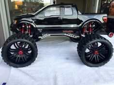 a toy truck is on display in front of a man