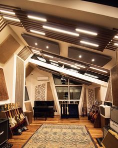 a room filled with lots of guitars and amps