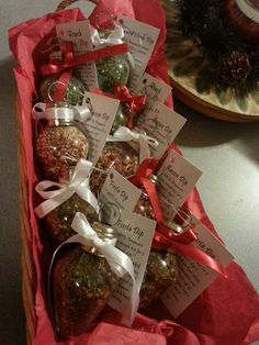 a box filled with lots of different types of christmas ornaments on top of a table