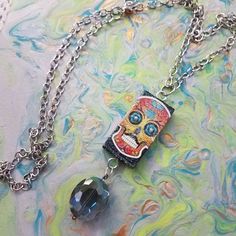 "This Upcycled Domino Is Just Fun  A Decoupaged Sugar Skull With Swarovski Crystal Eyes And An Iridescent Glitter Finish....Then A 1\" Iridescent Faceted Bead...For Dessert!   The 36\" Silver Chain Can Be Shortened For Your Perfect Fit. FREE SHIPPING WITHIN THE US" Domino Necklace, Upcycled Necklace, Sugar Skull Necklace, Sugar Skull Jewelry, Crystal Eyes, Crystal Eye, Skull Jewelry, Skull Necklace, Necklace Unique