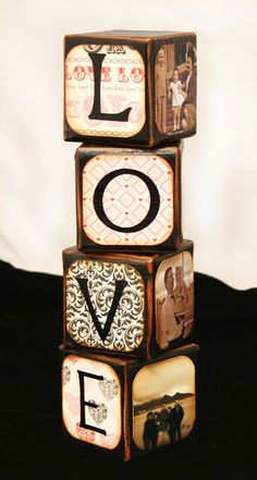 a stack of wooden blocks with the word love written on them in black and white