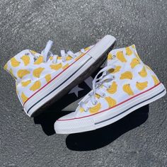 GO BANANAS with our Banana Bunches High Top Converse!  These white high tops have a repeating pattern on the outside and inside panels of both shoes.We buy each pair of shoes BRAND NEW. Each pair is made to order, please make sure you put in the correct shoe size before you check out. The paint is permanent and will never come off, fade away, or peel off. Made in the USA. This price includes everything: shoes, artwork, and shipping. Thanks for stopping by our Etsy shop! Please message me with an Trendy White High-top Sneakers With Speckled Midsole, White Custom Sneakers For Summer Streetwear, Summer High-top Sneakers With Gum Sole, Trendy White High-top Sneakers With Gum Sole, White Sneakers With Gum Sole For Summer, Trendy White High-top Custom Sneakers, White High-top Casual Custom Sneakers, White High-top Sneakers For Summer, White Slip-on High-top Casual Sneakers