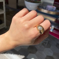 Who can say no to a chunky AF gold dome ring - let alone one with a bright and sparkly diamond? She’s a French little number in 18kt light rose gold - a sweet, pinky middle ground between yellow and rose. We adore the spread of this guy on one’s finger, it’s perfect for those who love a bolder, gold heavy vibe when it comes to their jewelry. The ring also has some patina that we love, but can be buffed out upon request.18kt light rose gold, size 7.25Diamond is estimated to be I/J color & VS clar Yellow Gold Dome Ring With Rose Cut Diamonds, Gold Domed Ring With Brilliant Cut, Everyday Yellow Gold Diamond Signet Ring, Oval Yellow Gold Diamond Dome Ring, Domed Yellow Gold Rings With Rose Cut Diamonds, Oval Dome Ring With Rose Cut Diamonds, Everyday Diamond Oval Signet Ring, Everyday Oval Diamond Signet Ring, Yellow Gold Engraved Hoop Earrings